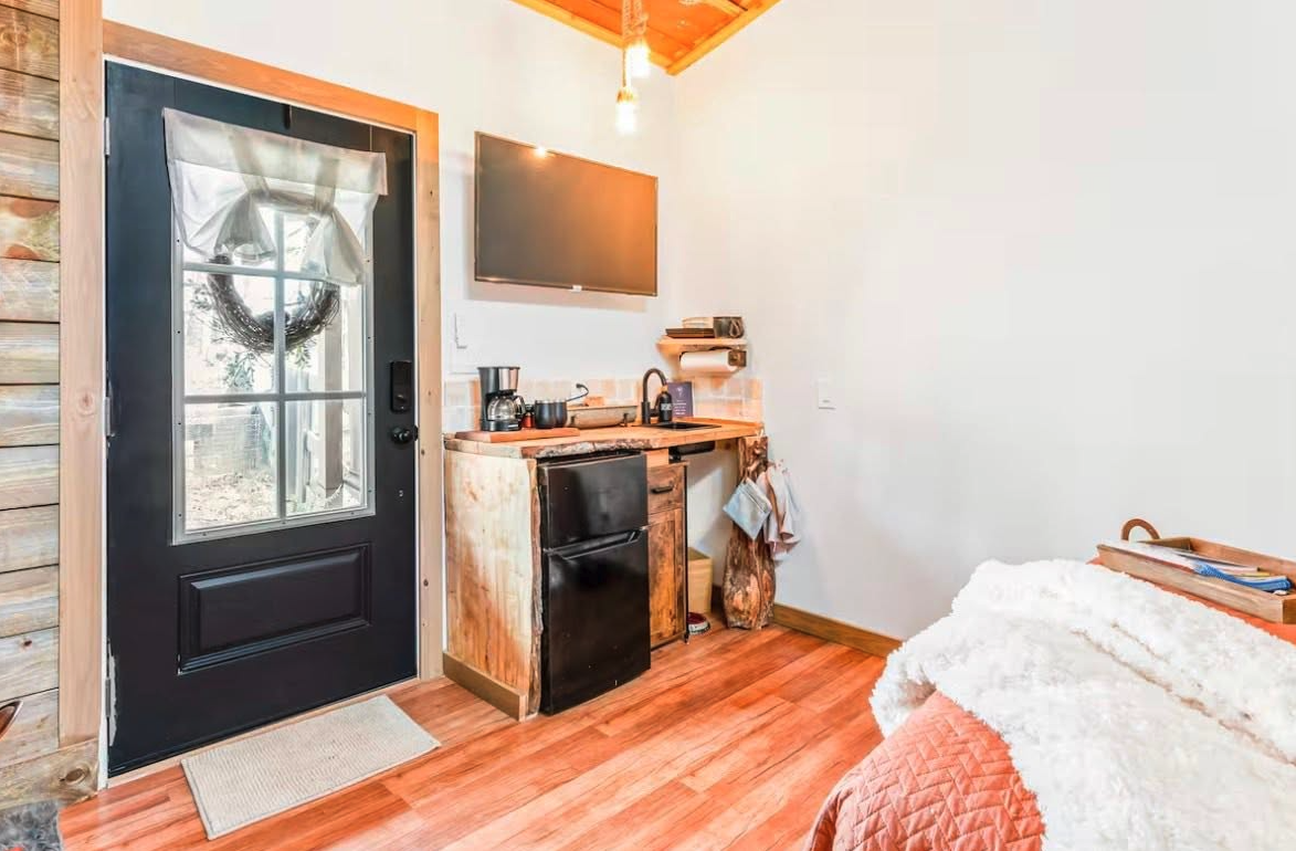 Warm interior of the cabin with wood floors and morning light